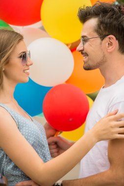 Young couple with balloons clipart