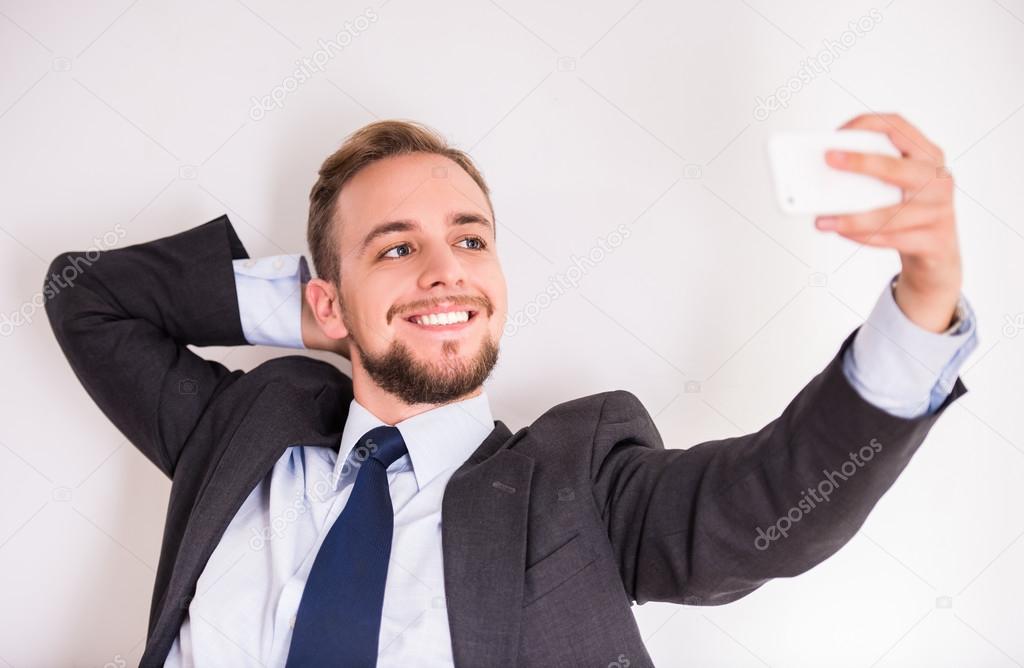 Portrait of a young cheerful businessman