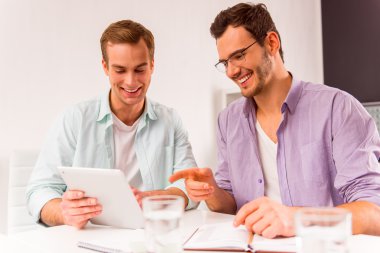 Attractive businessmen co-working