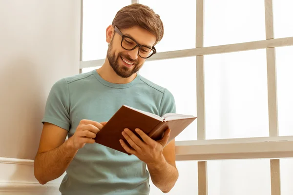 Handsome man with book — Stock Photo, Image