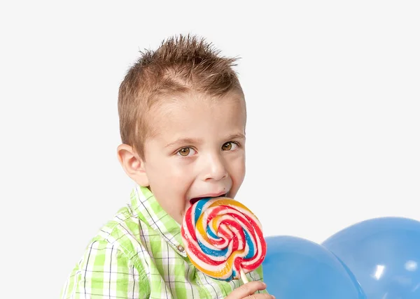 Smiley little boy with lollipop — Stock Photo, Image