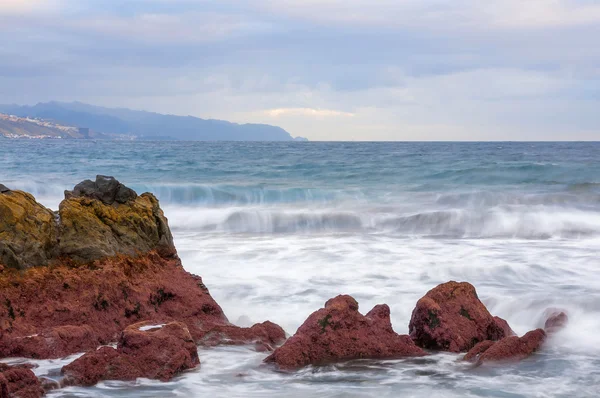 Sunrise on black sand volcanic beach. Tenerife — Stock Photo, Image