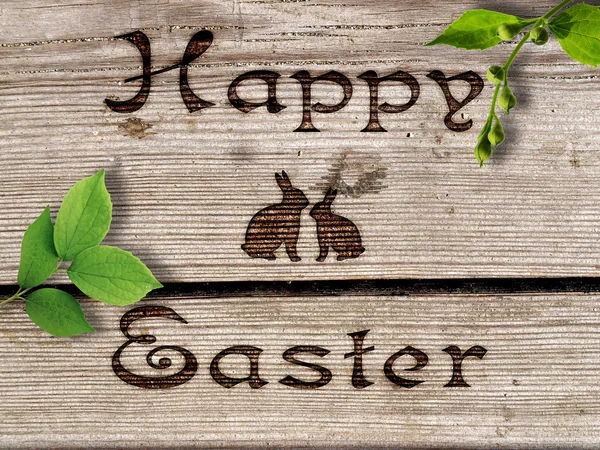 Happy Easter - burned an inscription on a wood. — Stock Photo, Image