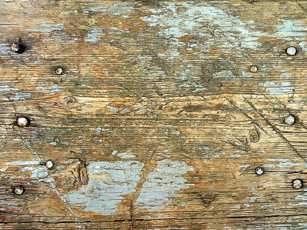 Textura de madera con clavos y restos de pintura agrietada Fotos De Stock