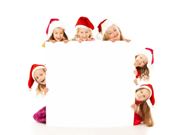 Christmas children with white banner — Stock Photo, Image