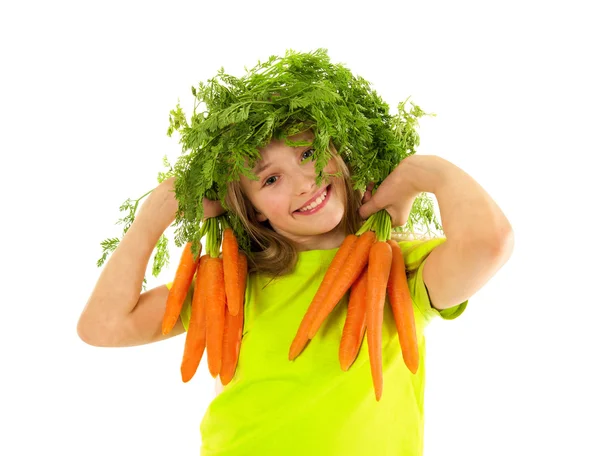 Schönes kleines Mädchen mit Karotten — Stockfoto