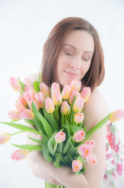 Portrait of young woman with  tulips — Stock Photo, Image