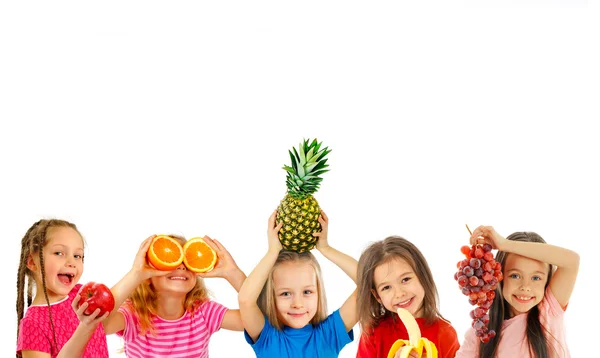 Happy children with fruits — Stock Photo, Image