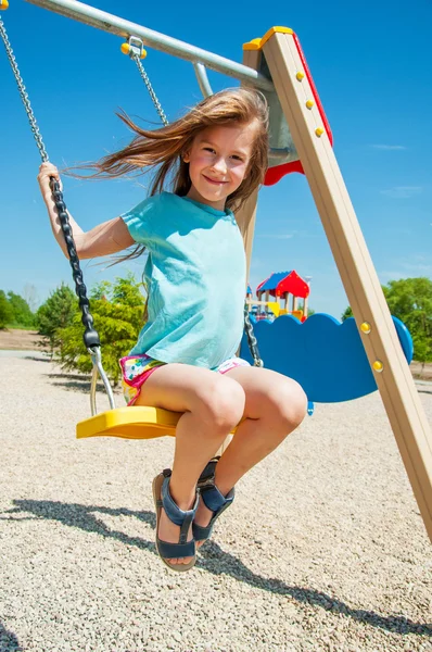 Adorable girl on a swing — Stock Photo, Image