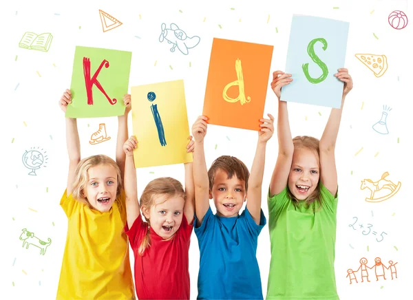 Kids holding colorful sheets with letters — Stock Photo, Image