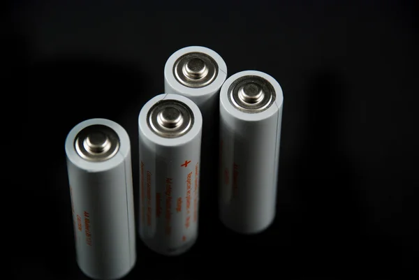 Batteries on black background Stock Image