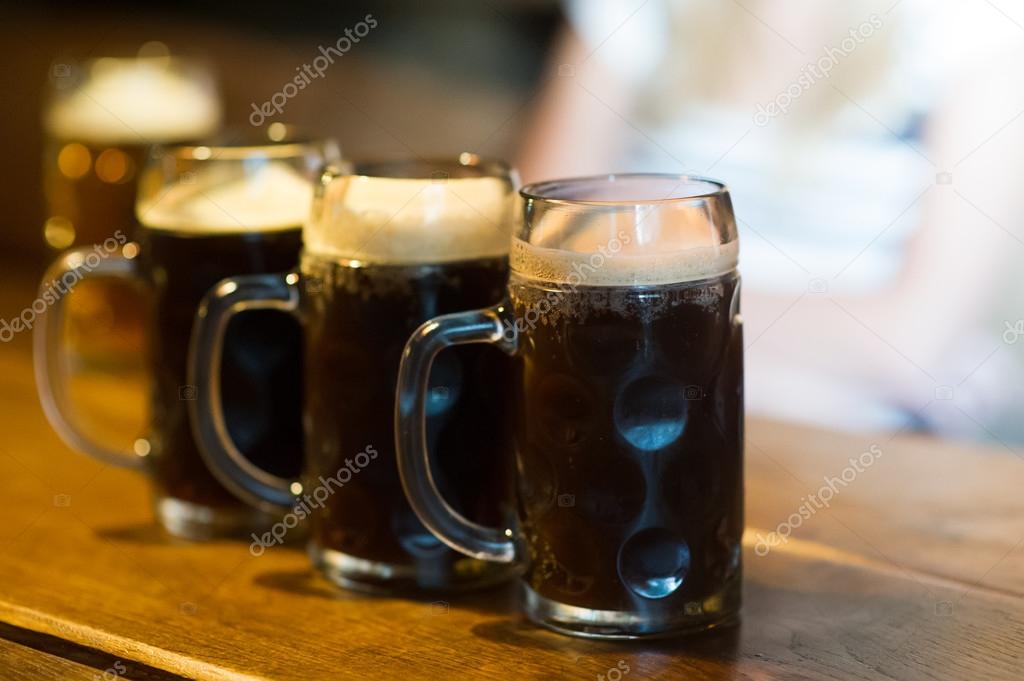 Glasses of dark beer
