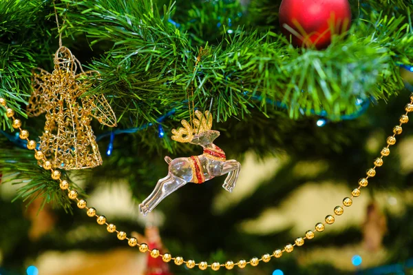 Christmas and New Year's toys on the Christmas tree — Stock Photo, Image