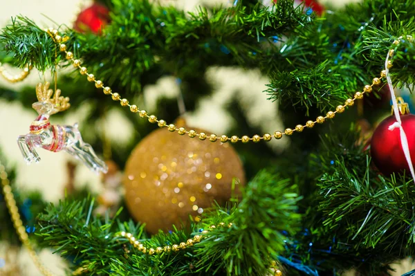 Christmas and New Year's toys on the Christmas tree — Stock Photo, Image