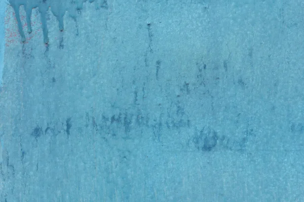 texture of blue painted wall outside