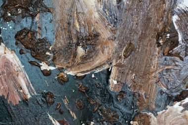 the wall is stained with brown and white paint