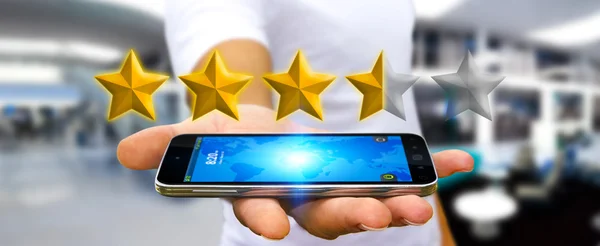 Estrelas classificação Empresário com seu telefone móvel — Fotografia de Stock