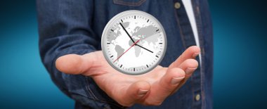 İş adamı elinde bir saat tutuyor.