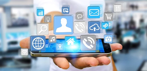 Affärsman med modern digital ikon programmet på sin mobil — Stockfoto
