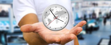 İş adamı elinde bir saat tutuyor.