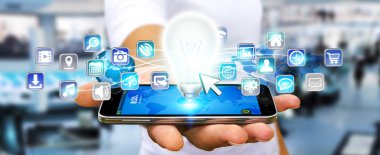 Ampul dijital simgelerle tutan işadamı