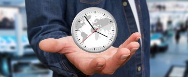 İş adamı elinde bir saat tutuyor.