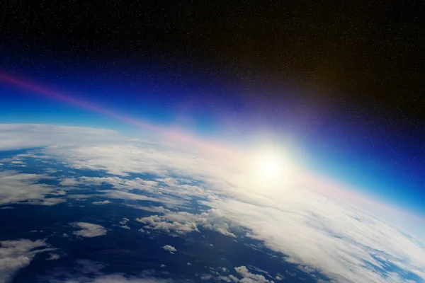 Схід над планетою Земля в космосі — стокове фото