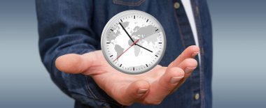 İş adamı elinde bir saat tutuyor.