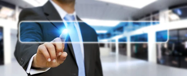 Businessman touching modern tactile screen button — Stock Photo, Image