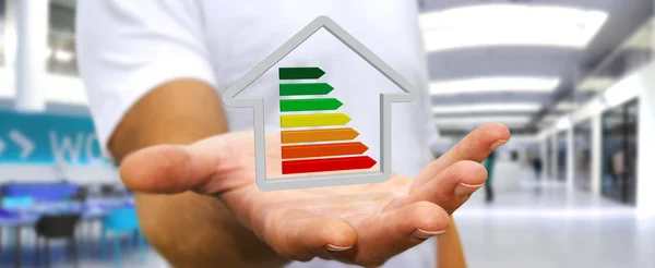 Empresario sosteniendo eco casa 3D y eficiencia energética —  Fotos de Stock