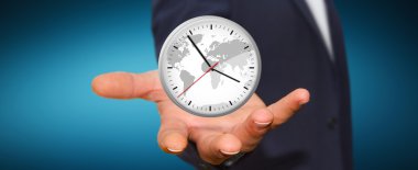 İş adamı elinde bir saat tutuyor.