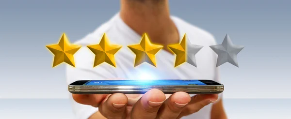 Estrelas classificação Empresário com seu telefone móvel — Fotografia de Stock