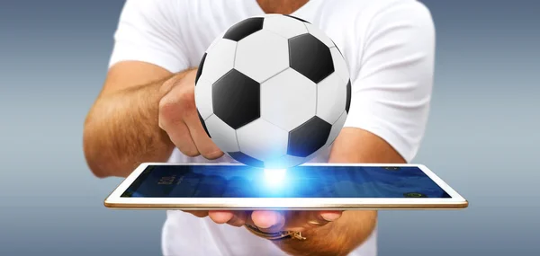 Affärsman håller fotboll i handen — Stockfoto