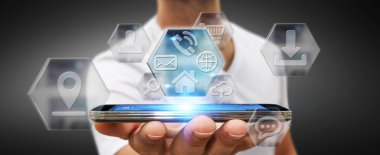 Modern dijital cep telefonu uygulamaları kullanarak iş adamı