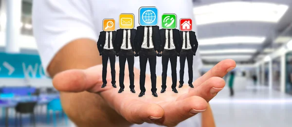 Ember üzletemberek csoportja tartja a kezében, az alkalmazás ic — Stock Fotó
