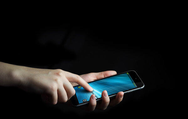 Businesswoman using modern mobile phone