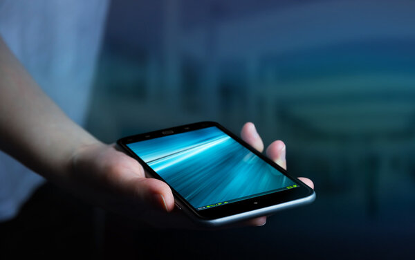 Businesswoman using modern mobile phone