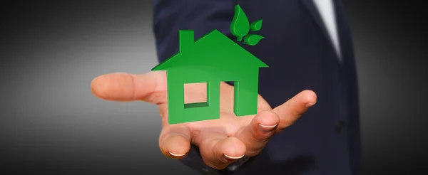 Affärsman holding 3d eco house och energieffektivitet — Stockfoto