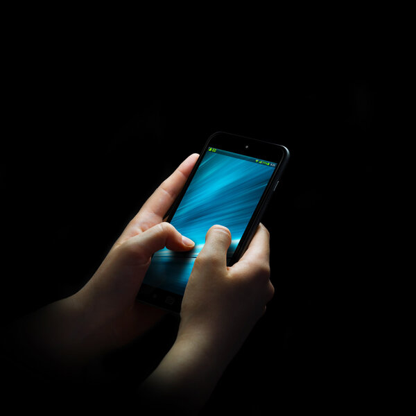 Businesswoman using modern mobile phone