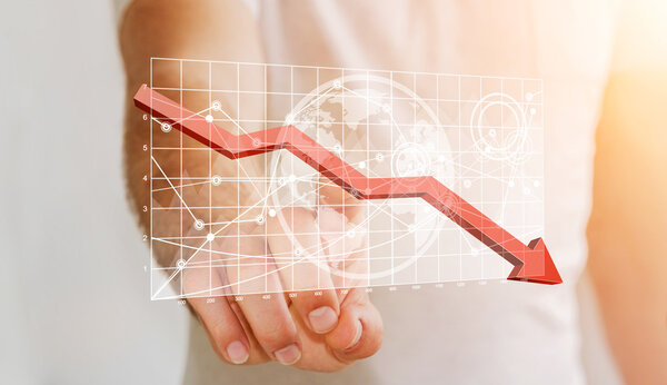 Businessman touching digital charts bars and red arrow