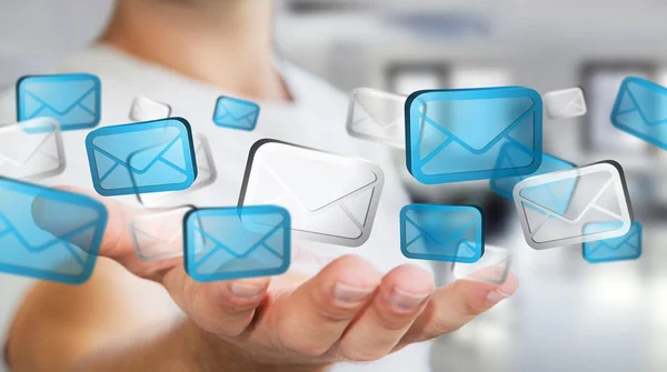 Businessman holding digital email icons
