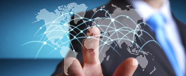 Businessman touching global network and data exchanges — Stock Photo, Image