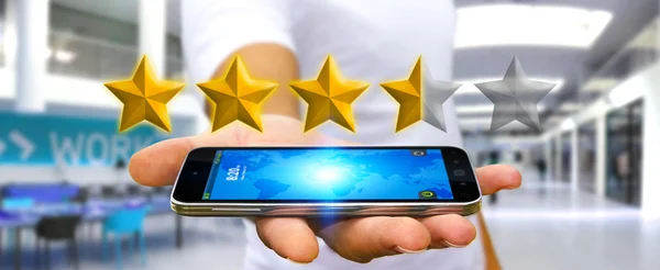 Businessman rating stars with his mobile phone