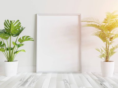 Beyaz çerçeve, iç kısımda, bitkilerin maketi ile birlikte yere dayanıyor. 3 boyutlu bir resimde çerçevelenmiş bir resmin şablonu