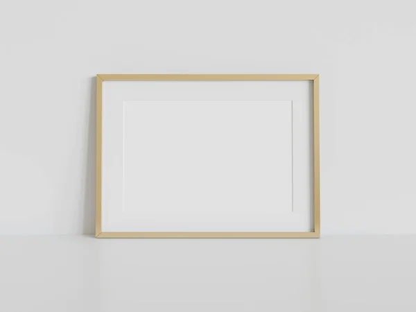 内部モックアップの白い床に傾いて黄金の長方形のフレーム 壁に額装された画像のテンプレート3Dレンダリング — ストック写真