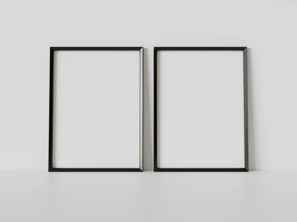 内部モックアップの白い床にもたれている2つの黒い長方形のフレーム 壁に額装された写真のテンプレート3Dレンダリング — ストック写真
