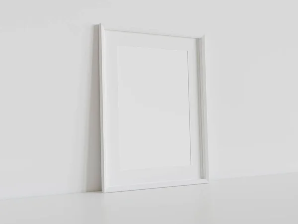 内部モックアップの白い床にもたれて白い長方形のフレーム 壁に額装された画像のテンプレート3Dレンダリング — ストック写真