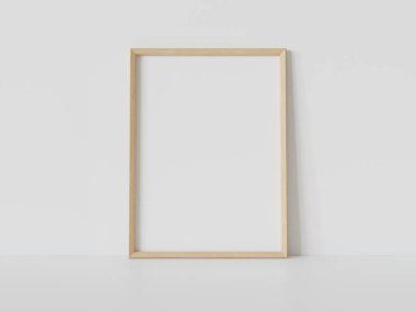 Ahşap dikdörtgen çerçeve, iç döşemede beyaz zemine dayanıyor. 3 boyutlu bir resimde çerçevelenmiş bir resmin şablonu