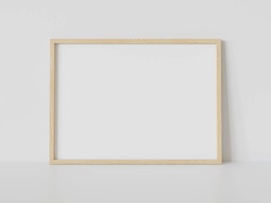 Ahşap dikdörtgen çerçeve, iç döşemede beyaz zemine dayanıyor. 3 boyutlu bir resimde çerçevelenmiş bir resmin şablonu