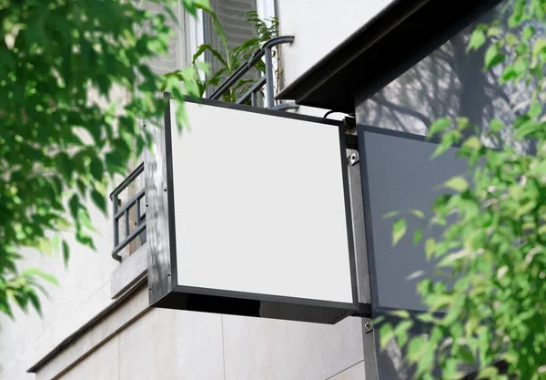 White store brand sign board mockup. Empty squared shop frontage in street